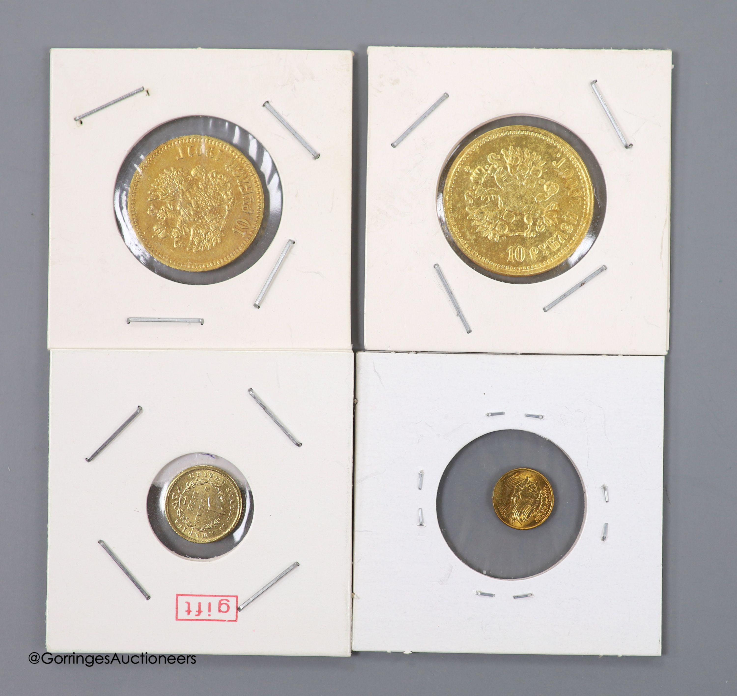 Four gold coins; 1901 ten roubles, 1900 ten roubles, 1862 one dollar and mini St Gauden coin.